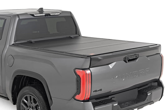 Rough Country Hard Tri-Fold Flip Up Bed Cover | 5'7" | Toyota Tundra 2WD/4WD (2022-2024)