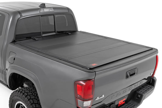 Rough Country Hard Tri-Fold Flip Up Bed Cover | 6' Bed | Toyota Tacoma 2WD/4WD (2016-2023)