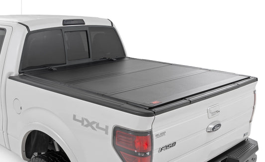 Rough Country Hard Tri-Fold Flip Up Bed Cover | 5'7" Bed | Ford F-150 2WD/4WD (2004-2014)