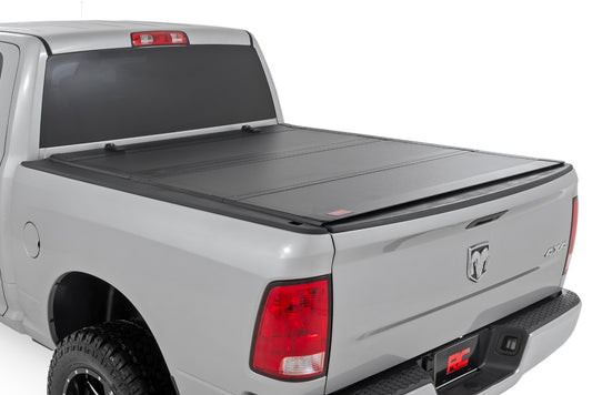 Rough Country Hard Tri-Fold Flip Up Bed Cover | 6'4" Bed | Ram 1500 (09-18)/2500 (10-24) 